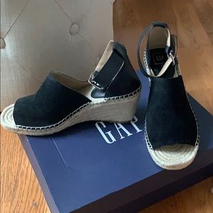 Black leather espadrilles.